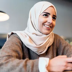 Female student engaging in mobile educational content