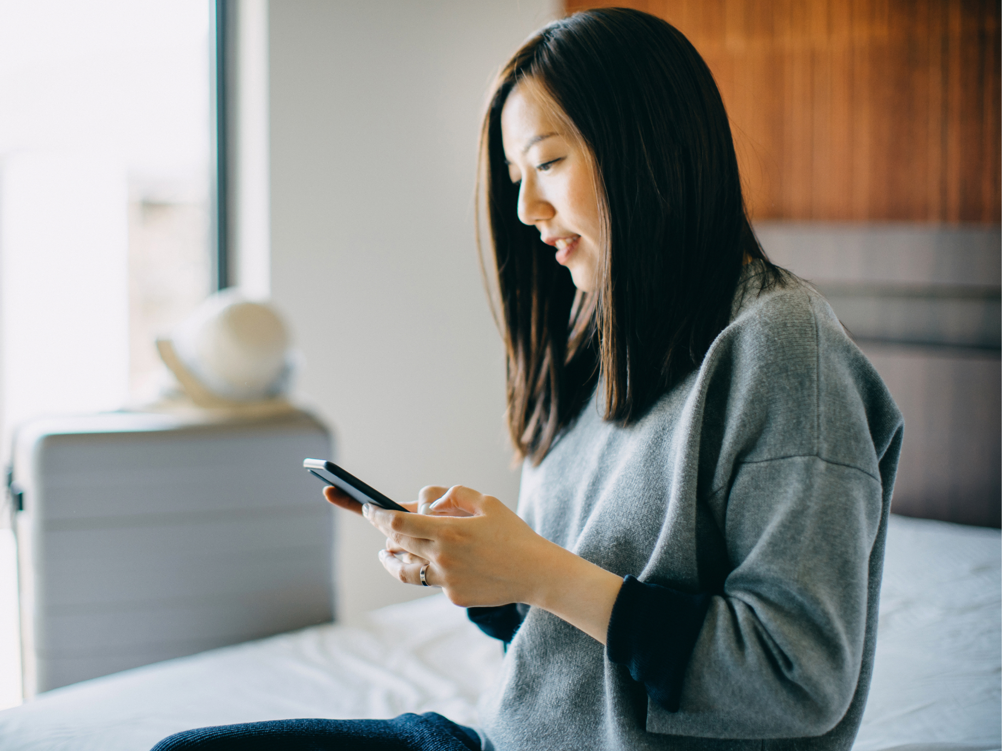 woman watching her phone