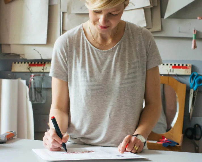 Women drawing whilst standing