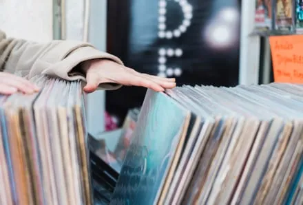 Hands flicking through records