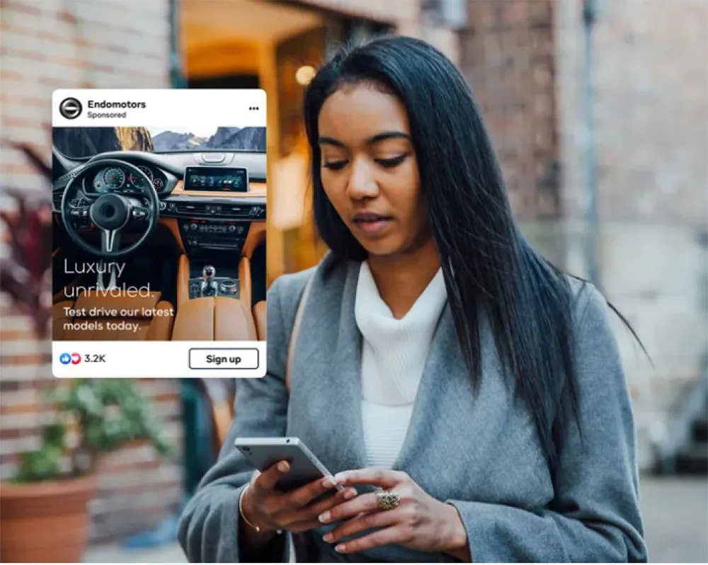 a woman on her phone examining a lead generation ad for Endomotors